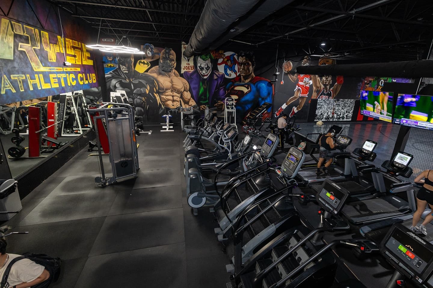 Superhero murals over the cardio floor
